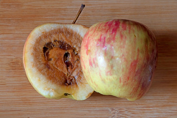 Rotten apple looking good from outside but its rotten from inside
