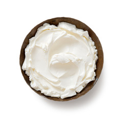 Bowl of cream cheese isolated on white background, top view .
