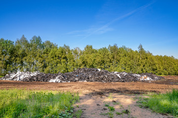 Polyethylene dump on the forest edge