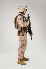 Fototapeta premium Rear view of military soldier US army marines operator studio shot portrait
