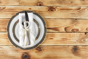 Beautiful table setting on wooden table from above