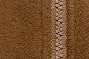 Texture of brown fleece with zipper