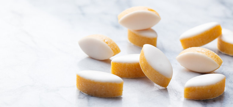Calisson on marble table background. Traditional French Provence sweets. Copy space.