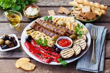 Kebab. Traditional meat kebab with grilled vegetables. Close up.