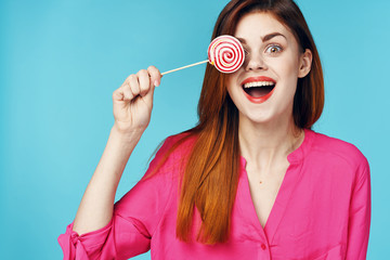 portrait of a woman with lollipop