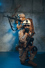 Two well equipped US army commandos armed with assault rifles. Studio shot