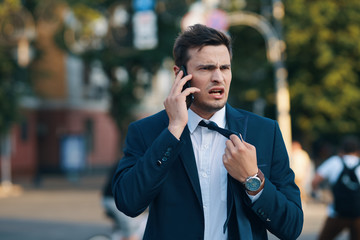 young businessman talking on cell phone