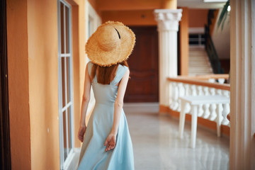 girl in white dress sitting on a chair