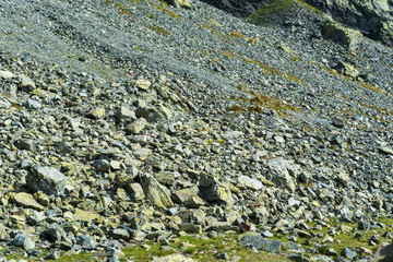Falls of stones at the base of the mountain.