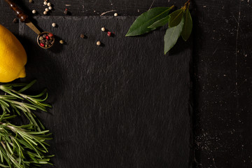 Slate food background with spice and copy space
