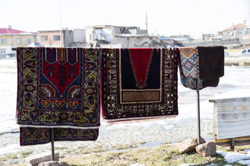 The carpets on the background in the store for special costumers from Nevsehir, Sivas and other Turkish city in Turkey.