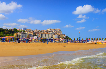 View of the little picturesque village in south Italy: Rodi Garganico and the beach at summer (Gargano, Puglia, Italy). It is a seaside resort with  long beaches located both west and east to town.