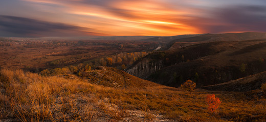 Autumn hills and bright morning sky