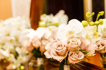 Brides bouquet of white and pink roses and orchid