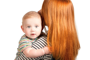 Young woman holds in her arms a little boy, isolated on a white background.