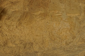 brown background of sand in a pile on the street - obrazy, fototapety, plakaty