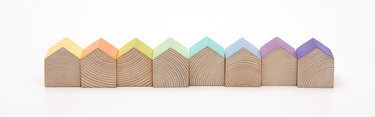 Wooden houses with colorful roofs arranged in row