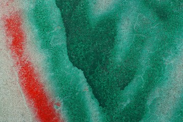 green red stone texture from dirty concrete wall