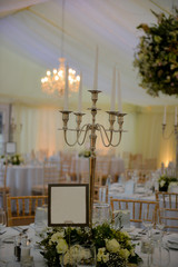 Candlestick with candles at a wedding venue. 