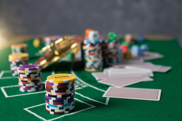 Fototapeta premium Casino equipment placed on the green floor for risky gambling for the people who want to get rich.