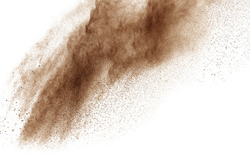 Fototapeta na wymiar Freeze motion of brown powder exploding. Abstract design of brown dust cloud against white background.