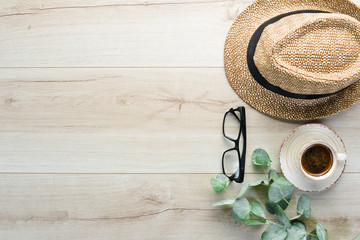 Travel accessories top view on wooden background with copy space. Adventure concept image with travel accessories.