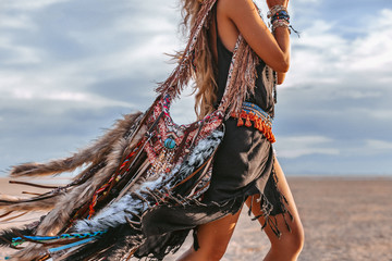 close up of young boho style woman on the beach at sunset © zolotareva_elina