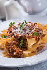 Italian ragu bolognese with flat fettuccine pasta