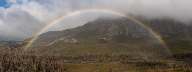 Rainbow with The Sentinels in Tasmania's South West