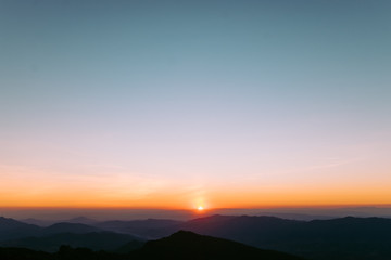 Dramatic sunset and sunrise over mountain morning twilight evening sky.