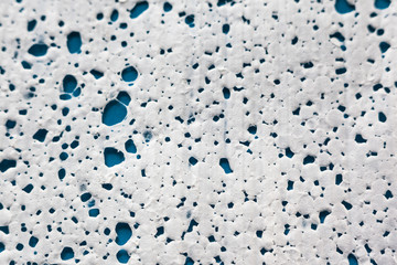 The texture of expanded polystyrene closeup. Sound and thermal insulation for construction, production of containers and lodges.