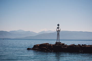 Vocation in Greece, Corfu. Water, cliff, mountains, and beautiful summer evening 