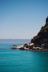 Vocation in Greece, Corfu. Water, cliff, mountains, and beautiful summer evening 