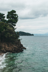 Vocation in Greece, Corfu. Water, cliff, mountains, and beautiful summer evening 