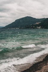 Vocation in Greece, Corfu. Water, cliff, mountains, and beautiful summer evening 