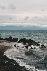 Vocation in Greece, Corfu. Water, cliff, mountains, and beautiful summer evening 