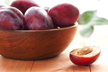 Plums on a light background. Summer vitamins