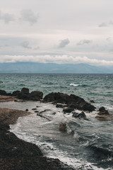 Vocation in Greece, Corfu. Water, cliff, mountains, and beautiful summer evening 