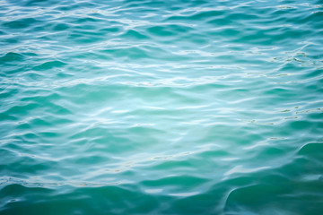 Blue sea wave ripple curl water surface texture. Summer holiday relax background with copy space.