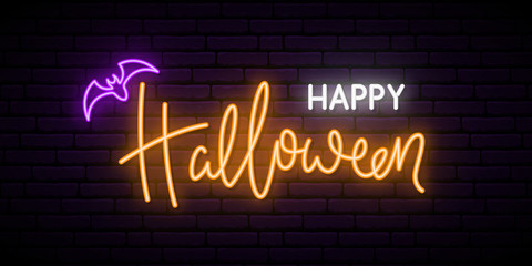Happy Halloween neon sign board. Bright light inscription on brick wall background. © greens87
