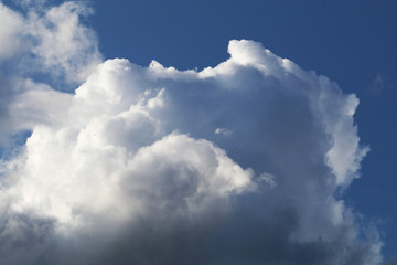 puffy clouds blue sky