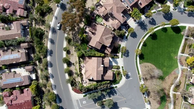 Aerial view suburban neighborhood with identical villas next to each other. San Diego, California, USA. Residential modern subdivision luxury house.