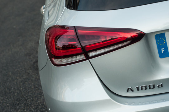 Mulhouse - France - 14 September 2019 - Closeup of rear light and sign on grey Mercedes A180 parked in the street