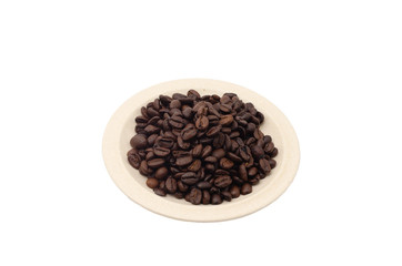 Coffee beans in a porcelain plate isolated on white background