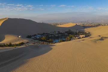 Aerial view of Huacachina Oasis, in the desert sand dunes near the city of Ica, Peru