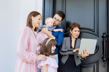 Fototapeta premium Happy family consulting with their real estate agent