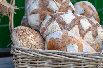 Different varieties of bread in a basket.