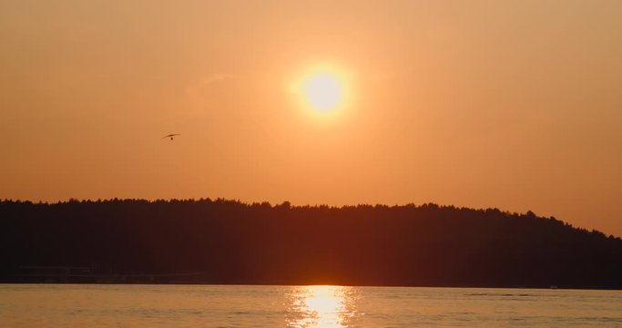 sunset lake sport hang glider beach