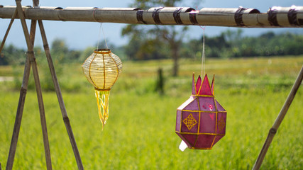 Lanna lantern is shown on the farmer field.