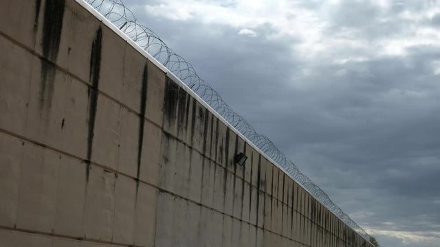 prision wall and cloudy sky